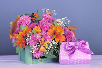 Flowers composition in crate with present