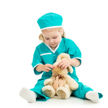 kid playing doctor and curing toy