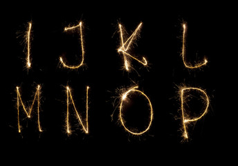 Shiny alphabet isolated on black