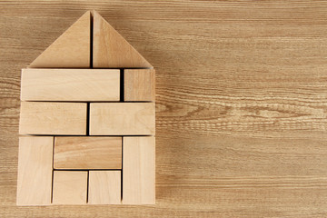 Wooden toy blocks on wooden background