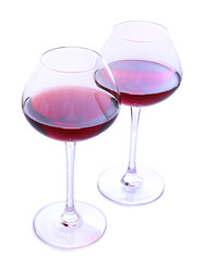 Wineglasses with red wine, isolated on white