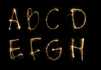 Shiny alphabet isolated on black