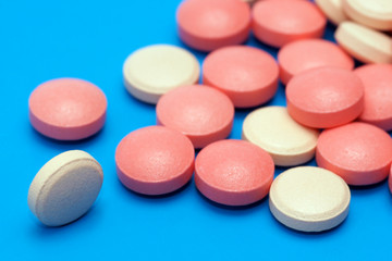 Pills, capsules on blue background, Pharmacy, Medicine
