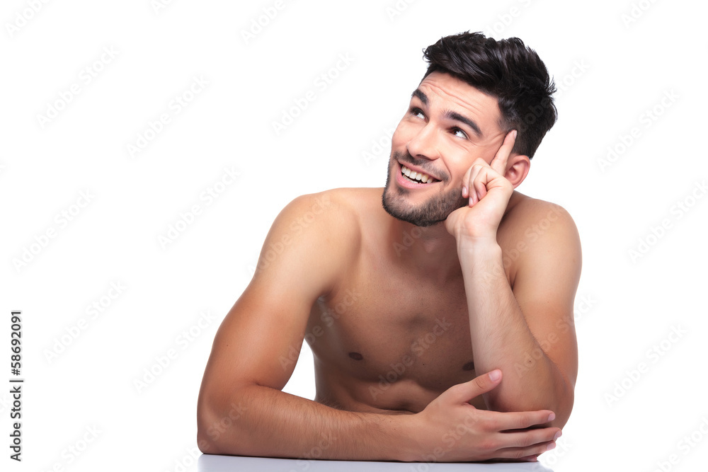 Fototapete smiling naked beauty man is looking up to his side