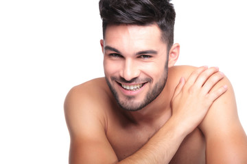 Obraz premium smiling naked man with hand on his shoulder