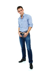 Young cheerful man in blue shirt and jeans, portrait of attracti