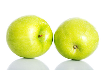 Two green apples over white.