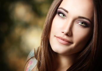 young cute attractive girl portrait with long hair looking at ca