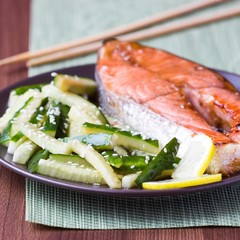 Red fish grilled salmon with cucumber salad and soy sauce, Japan
