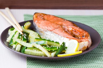 Red fish grilled salmon with cucumber salad and soy sauce, Japan