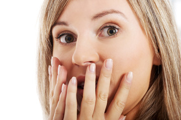 Young woman's face expressing shock/  surprise.