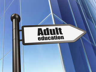 Education concept: sign Adult Education on Building background