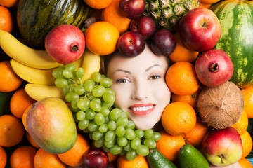 Woman face in fruits.