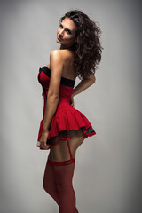 Fototapeta premium Sexy woman posing in red dress