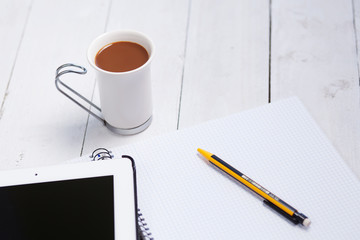 Coffe business showing tablet pc and pencil