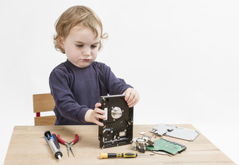 child repairing hard disk drive