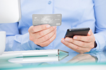 Businesswoman Holding Cellphone And Credit Card