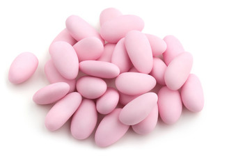 pink sugared almonds on white background