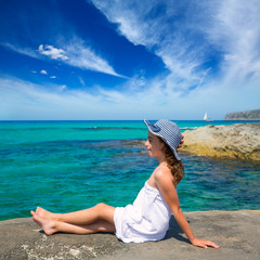 Girl looking at beach in Formentera turquoise Mediterranean