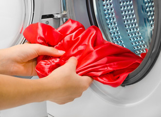 Housework: young woman doing laundry