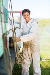 Happy Beekeeper Preparing Smoker On Truck