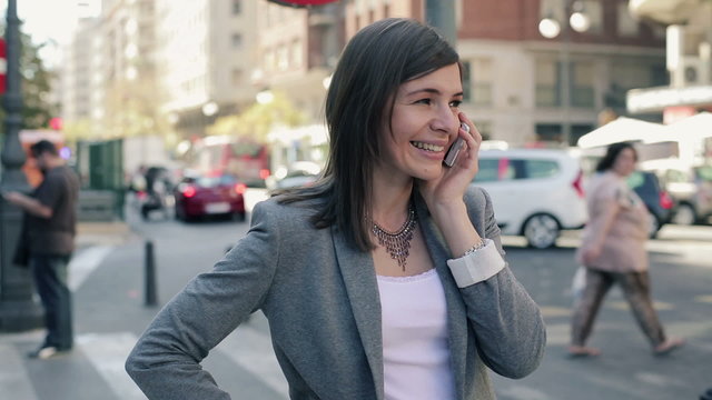 Young attractive businesswoman talking on cellphone