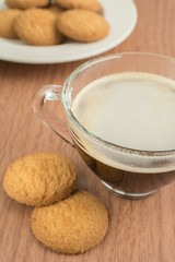 Coffee cup and butter biscuit