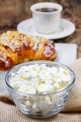 Healthy breakfast: french croissant with nuts & bowl of cottage