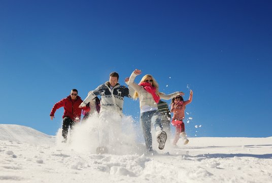 Friends Have Fun At Winter On Fresh Snow