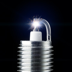 working spark plug with blue sparkle