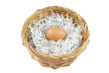 Egg in a wicker basket isolated with clipping path