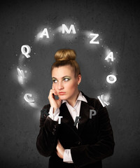 Young woman thinking with letter circulation around her head