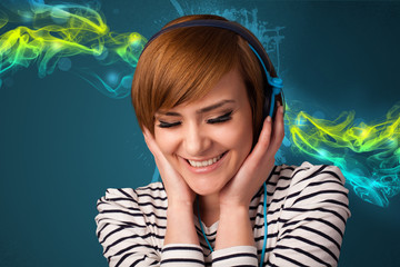 Young woman listening to music with headphones