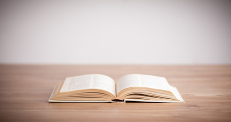 Open book on wooden deck
