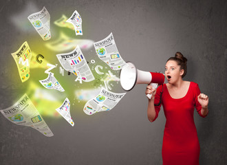 Girl yelling into loudspeaker and newspapers fly out