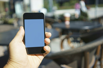 using mobile phone at a cafe