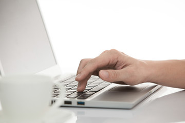 businessman typing on laptop computer