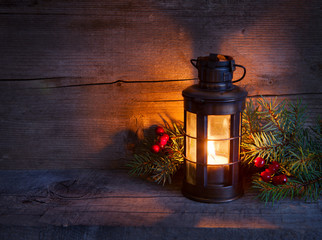 Cristmas lantern  in night on old wooden background. © Antonel