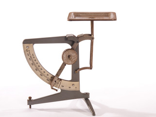 antique postage scale on white background - 58725603