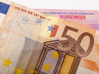 50 euro banknote and car license - 58725642