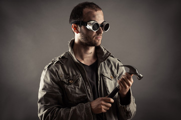 portrait of the mad miner with a hammer in hand