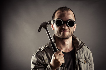 portrait of the mad miner with a hammer in hand
