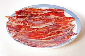 Spanish ham isolated over white