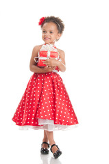 Happy little girl with a gift in hands.