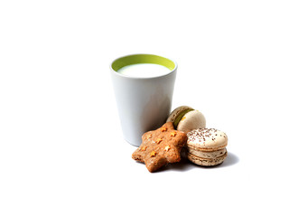 delicious colored macaroons and cooky with milk