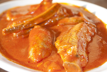 ribs and sausages in tomato sauce