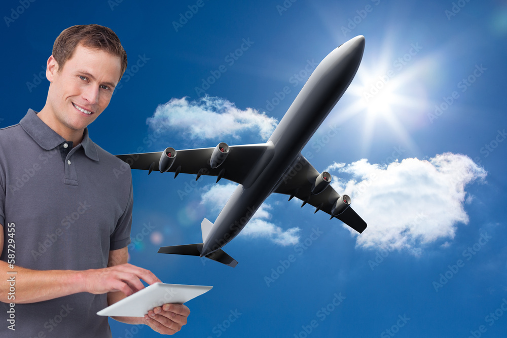 Poster Composite image of smiling young man with tablet computer