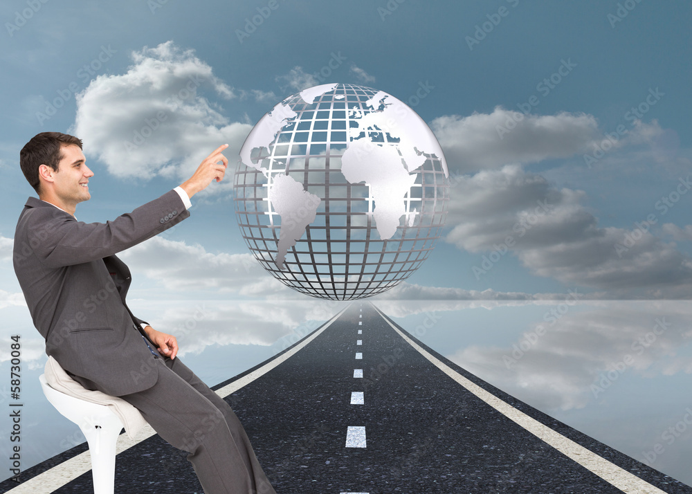 Poster Composite image of smiling classy businessman sitting and pointi