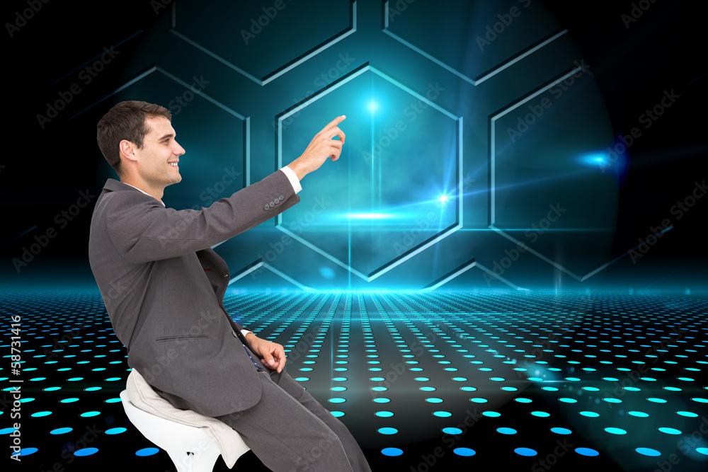 Poster Composite image of smiling classy businessman sitting and pointi