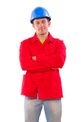 Happy builder with crossed hands isolated on white